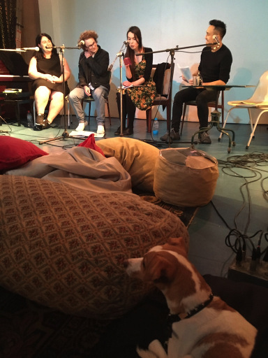 A panel of four. There are beanbags and a small dog in the foreground.